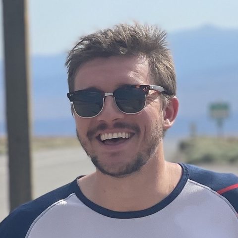 Ian Hefflefinger smiling outdoors in sunglasses